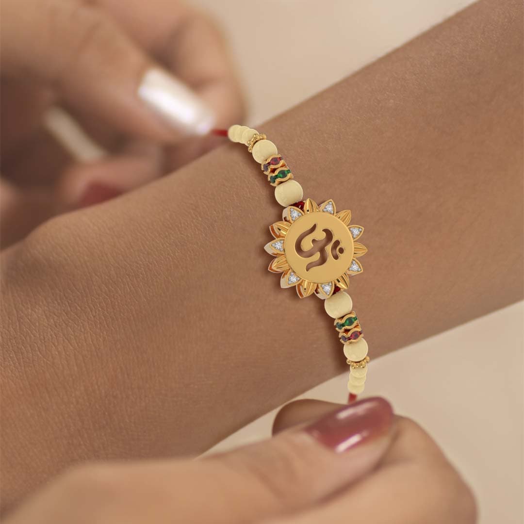 Flower Shape Om Design Diamond Yellow Gold Rakhi